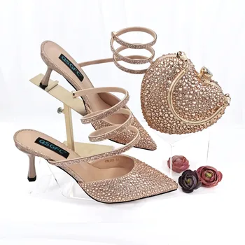 Остроносые туфли с обертывающимся ремешком от PM Nigeria Fashion Design Сочетаются с мини-сумкой с кристаллами в форме сердца